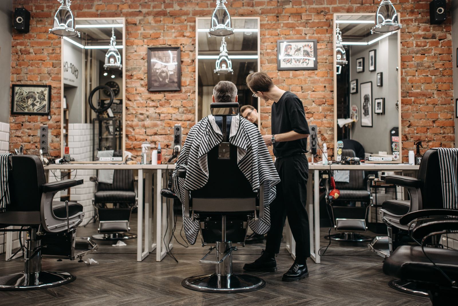 Local barbershop owner at work - why a text beats a voicemail after a missed call